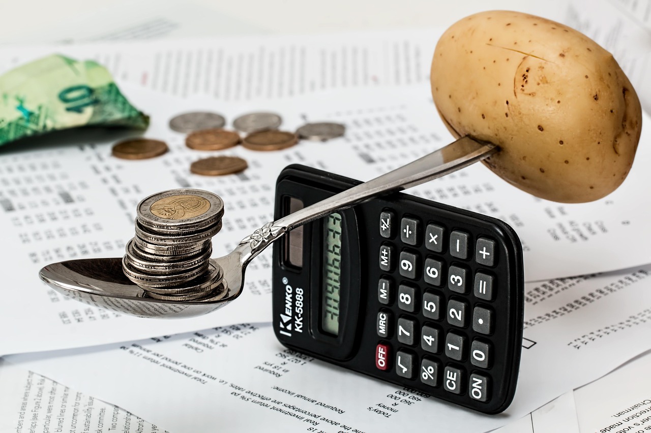 coins and a calculator for budget planning